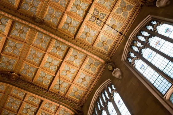 Ornate gold tiles line the ceiling of the law library.