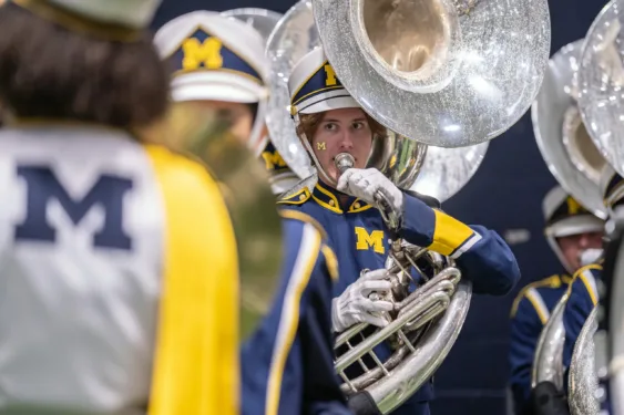 A member of the Michigan Marching Band helps celebrate at the Parent and Family Weekend Tailgate.